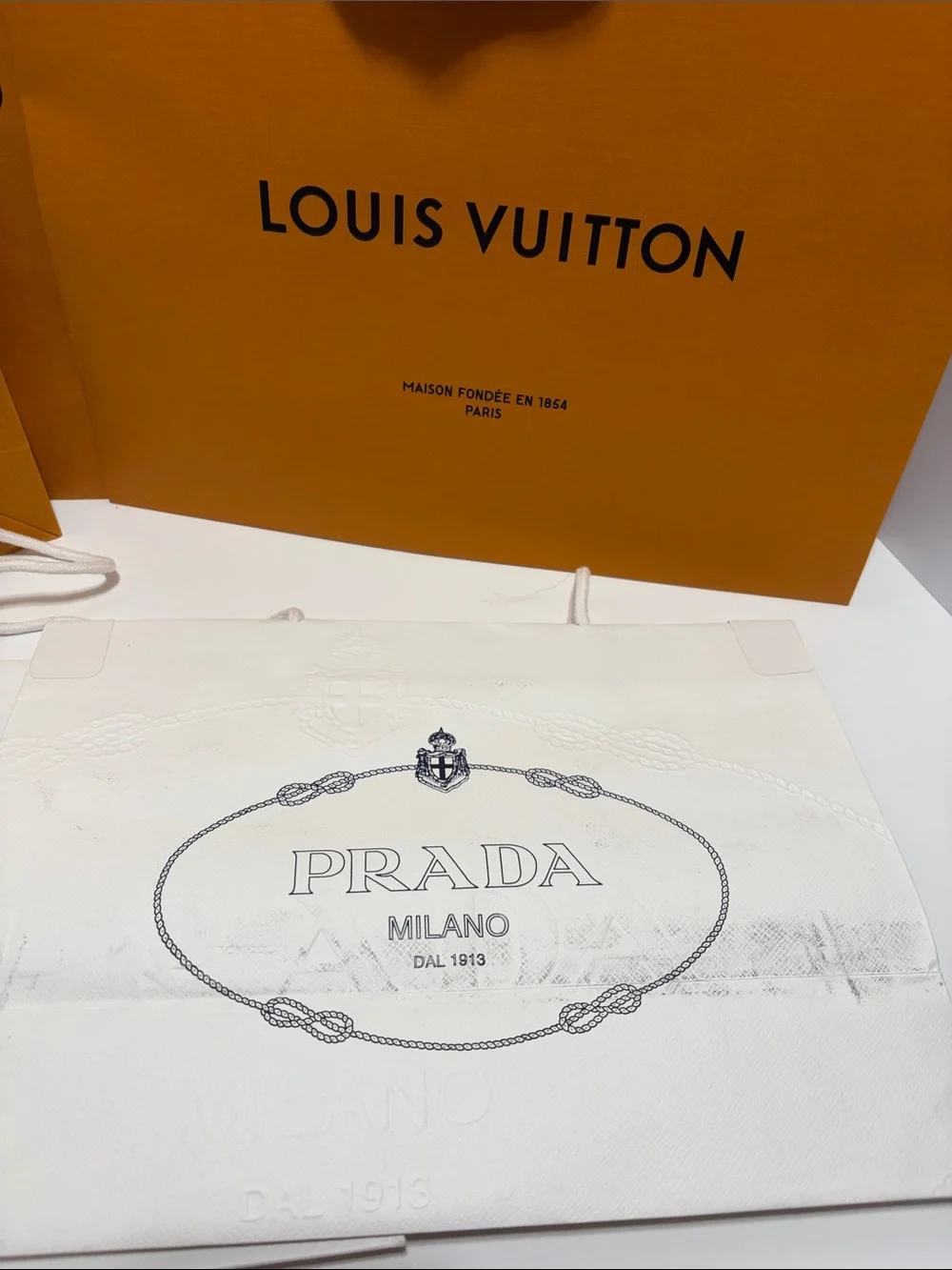 3 Louis Vuitton Orange Shopping Bag with 2 White Prada Bag